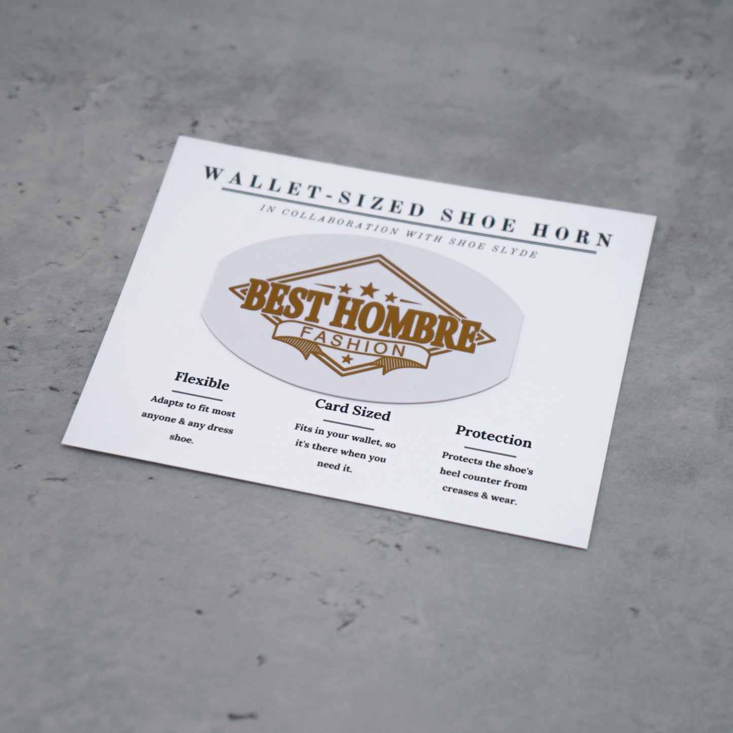 Overhead photo of the gold and white best hombre fashion shoeslyde in packaging