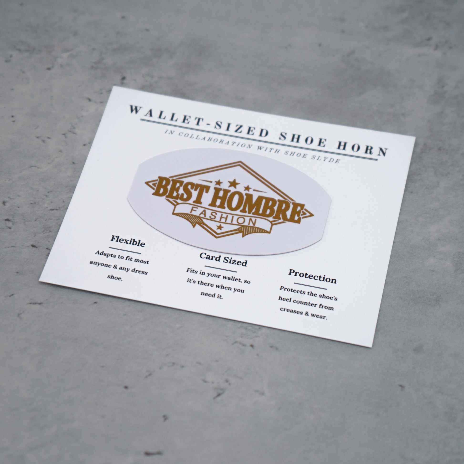 Overhead photo of the gold and white best hombre fashion shoeslyde in packaging