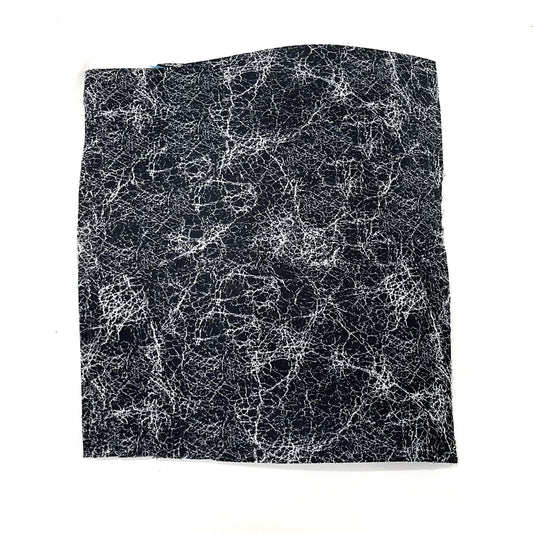 close up view of pure silver infusd nylon footbed.
Nylon is black and the silver fibers are well silver. and the pattern is a disarray of imperfect lines in an all over splatter pattern