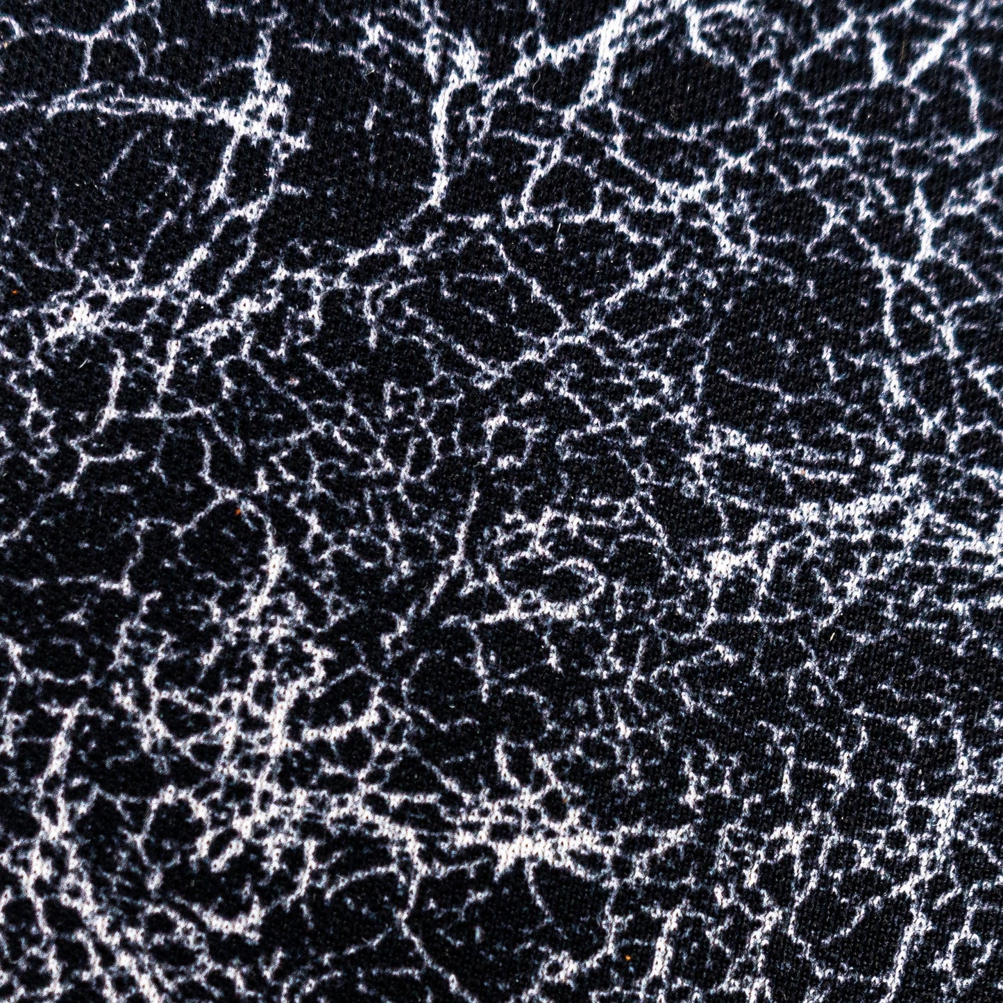 close up view of pure silver infusd nylon footbed.
Nylon is black and the silver fibers are well silver. and the pattern is a disarray of imperfect lines in an all over splatter pattern