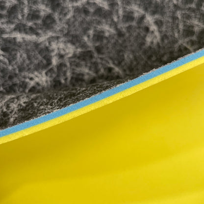 Close up image of side profile of a 1/4" sheet that has 3 layers, the black thin footbed layer, the 1/8"BounceBlu Layer and the 1/8" VeloShox Layer.