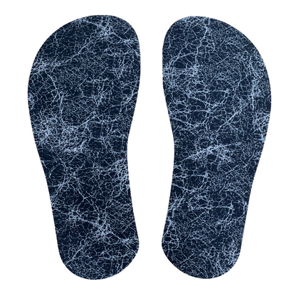 overhead shot of two cut out barefoot style insoles from our insole sheets. The footbed is the Silver AG 2.0 footbed that is black with white lines in a marbled pattern.