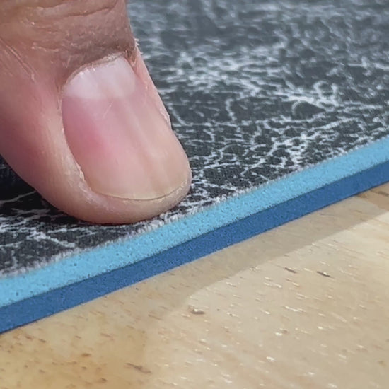Close-up of textured edge of our 1/4" insole sheet which combines 2 different insole materials plus the Pure silver infused AG 2.0 topliner.

The composition is 1/8"  BounceBlu foam on top, then the 1/8" Plush EVA foam at the bottom.